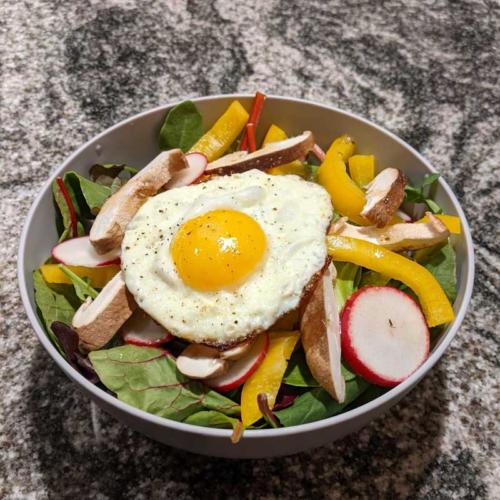 salad with sunny side up eggs